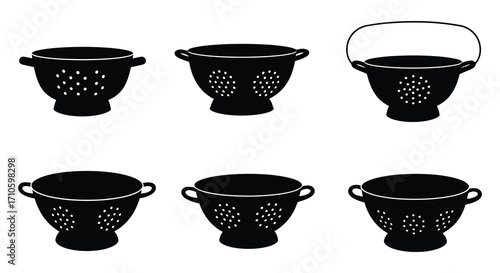 A collection of black silhouette kitchen strainers and colanders displayed neatly