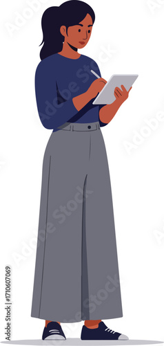 Woman in blue top and gray pants taking notes on a tablet.