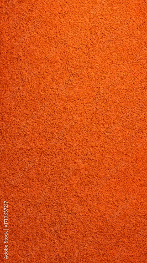 Fototapeta premium Bright orange textured wall surface with rough pattern