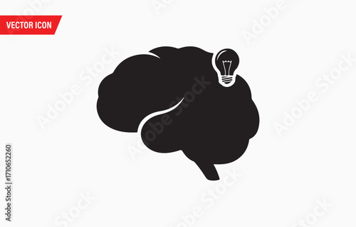 Silhouette of a human brain with a glowing light bulb idea symbolizing innovation