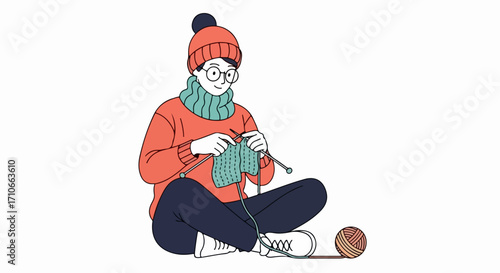 Knitting project displayed by young woman knitting in a cozy setting, seated on floor. Knitting project shows how needlework can be a creative pursuit, making garment with needles, ball of yarn.