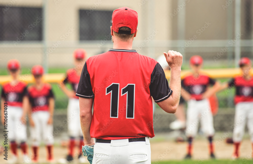 Fototapeta premium baseball coach instructs his students before the game