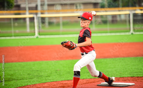 Canvas Print Young boy play baseball on summer day