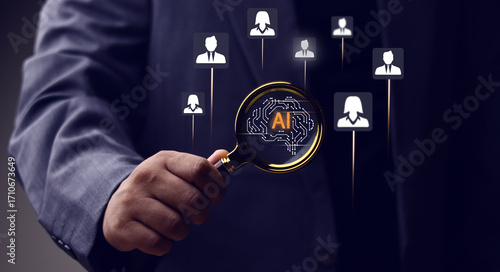 Businessman holds a magnifying glass over a brain AI icon, symbolizing the use of artificial intelligence for candidate screening and recruitment. A concept for HR technology and talent acquisition.