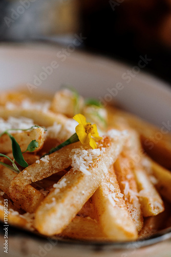 fried potato's in a bowl whit cheese