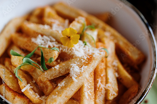 fried potato's in a bowl whit cheese