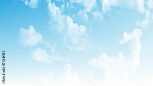 Clear blue sky with a few clouds. The sky is very bright and the clouds are scattered throughout. 