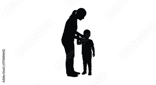 Silhouette of a mother gently interacting with her small child