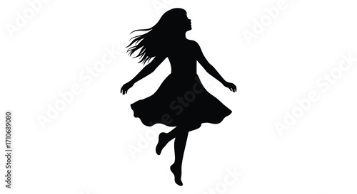 Silhouette of a woman in a flowing dress mid movement and joyful