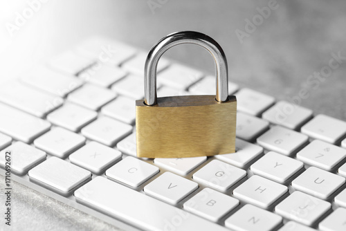 Wallpaper Mural Cyber safety. Metal padlock and computer keyboard on grey table, closeup Torontodigital.ca