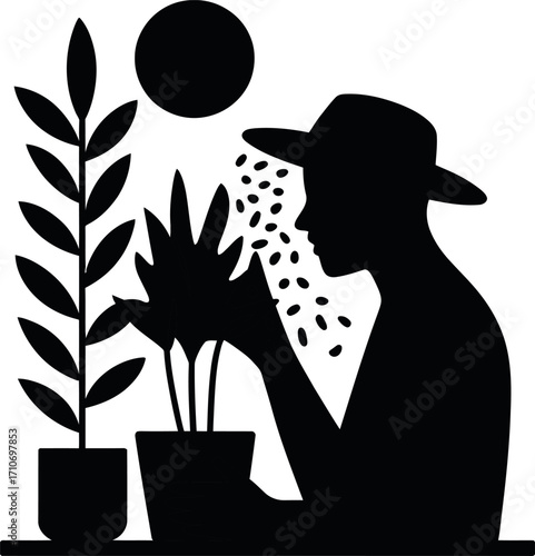 Silhouette of a person caring for indoor plants