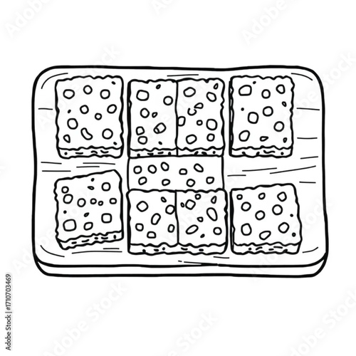 Homemade granola bars cut into squares on board