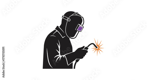 Silhouette of a welder working with sparks flying from the metal