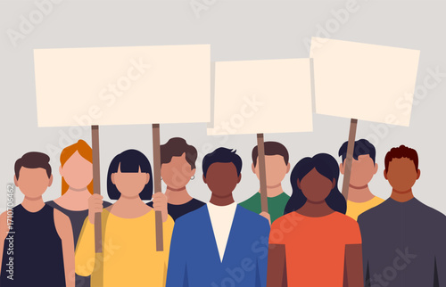 Diverse group of protesters standing together in a line, holding empty white rectangular signs on wooden poles.