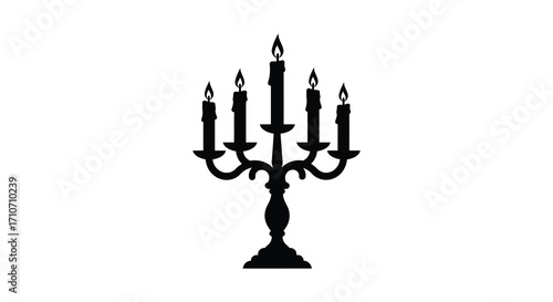 Elegant black silhouette of a five armed candelabra with lit flames