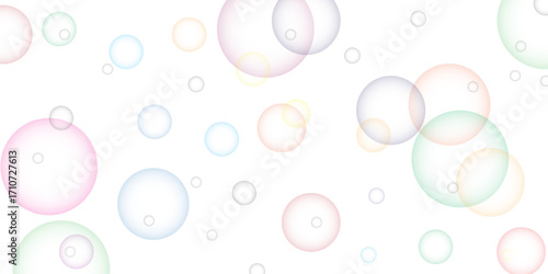 Soapy bright multicolored bubbles fly randomly on a white background. Beautiful circles colorful soap bubbles texture background. Design soap bubbles on a white background. Soap bubbles randomly flew.