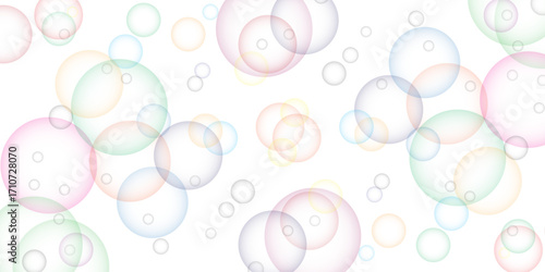 Soapy bright multicolored bubbles fly randomly on a white background. Beautiful circles colorful soap bubbles texture background. Design soap bubbles on a white background. Soap bubbles randomly flew.