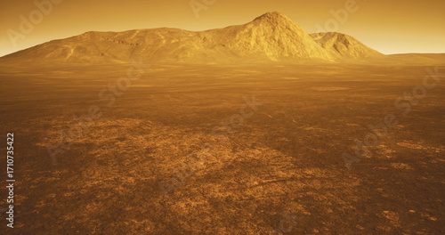 Fototapeta A stunning view of the surface of Venus features rocky mountains rising against a golden hued sky, with expansive flatlands stretching into the distance, creating an otherworldly atmosphere at dusk