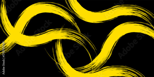 Neon yellow acrylic paint stroke isolated over black