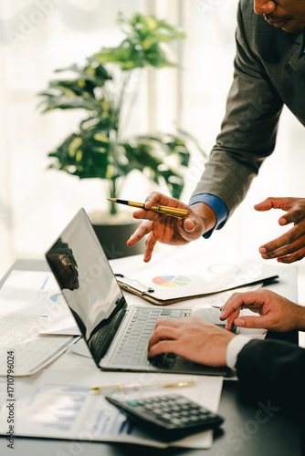 Young colleagues discussing business and price chart analyzes business people on the table great in modern coworking office teamwork concept. Calculate personal tax for customers