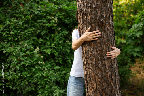Girl hugging tree, care of mental health.