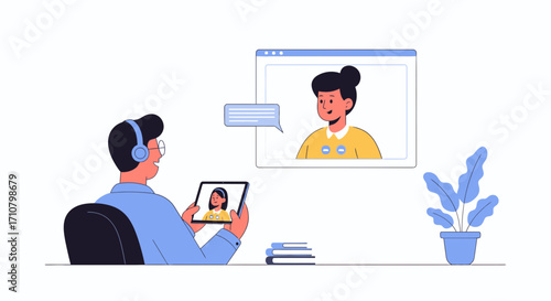 Man with headphones video conferencing on a tablet with a woman on screen, books, and a plant.