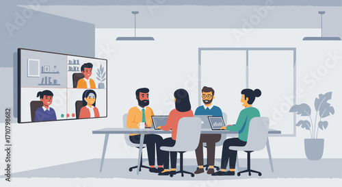 A group of colleagues are meeting in a conference room, while others join remotely via a large screen for a video call.