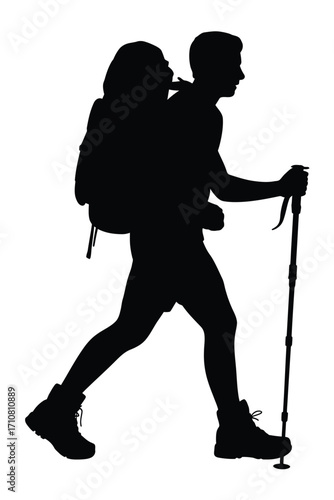 Silhouette of a hiker with backpack and trekking poles