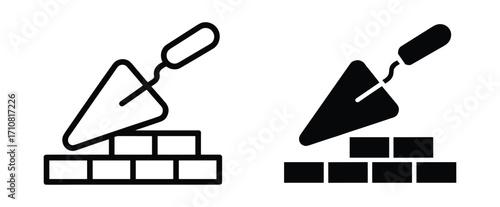 Black and white line art and solid icon of a trowel laying bricks on a white background bricklaying construction