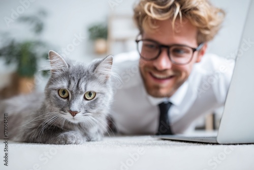 A handsome young man tenderly holds a fluffy white feline, their eyes locking in a beautiful, loving portrait
