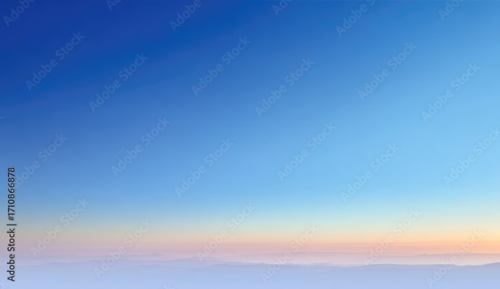Obraz premium Pale sunrise over hazy, misty landscape