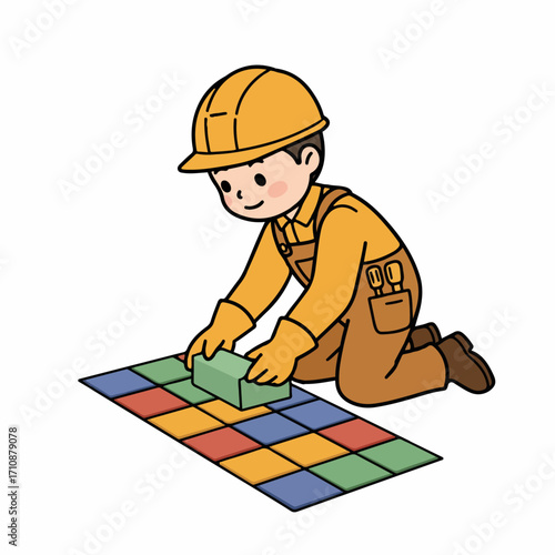 A construction worker in a yellow hard hat and overalls is kneeling and laying colorful tiles on the floor.
