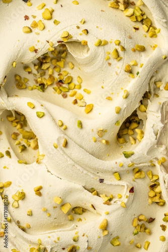 Pistachio gelato with crushed nuts closeup