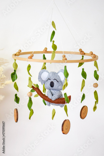 Handmade koala baby mobile with felt leaves and wooden details