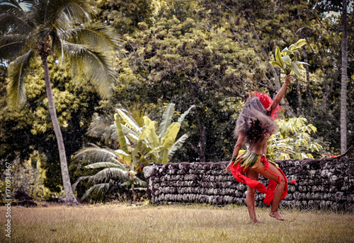 Photos Ori Tahiti Vahine dancing in front of sacred tahitian Marae