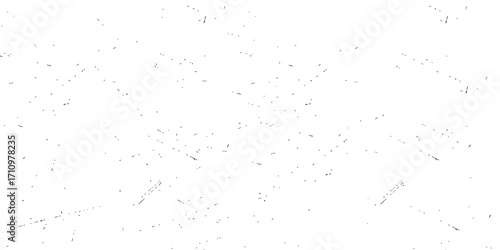 Abstract black paint splat on a textured vintage paper background with grunge and dust texture