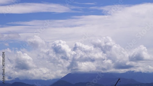 Clouds curl up into the air from the mountain—4K time-lapse recording 12x speed.