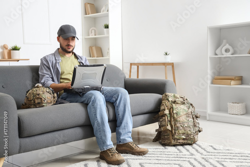 Young soldier working with ...