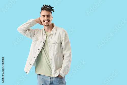 Young man with dreadlocks a...