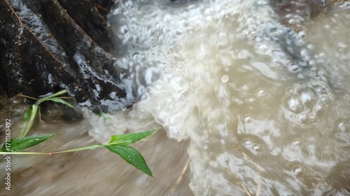 Rushing Water: A close-up view of turbulent water cascading down a weir, capturing the raw power and movement of the natural world.