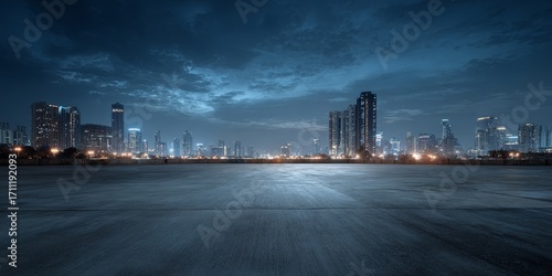 City skyline at dusk with empty ground in the foreground