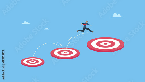 Businessman jumping on bigger and higher archery bull's eye target. Aspiration and motivation to achieve bigger business target, advancement in career or business growth.