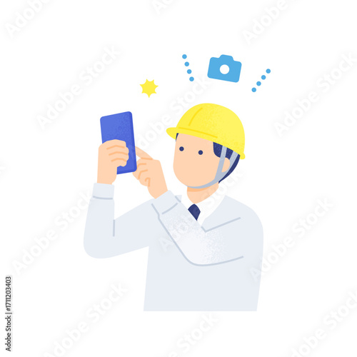 スマートフォンで工事現場の記録写真を撮影する男性作業員