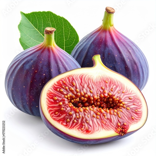Three figs two whole with deep purple skin, and one sliced in half revealing red pulp & tiny seeds, with a green leaf