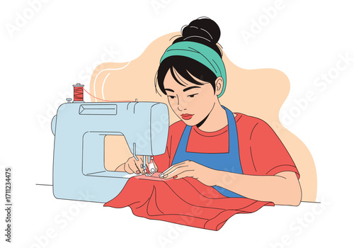 A woman wearing an apron and headband sits at a sewing machine and stitches red fabric.