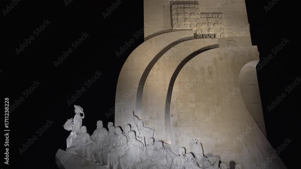 illuminated Monument to the Discoveries or Padrao dos Descobrimentos at the bank of Tagus River at Belem district at night.