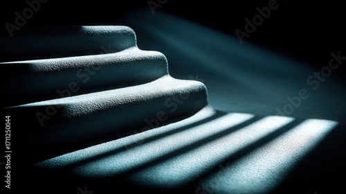 Curved steps in dim light, shadowed