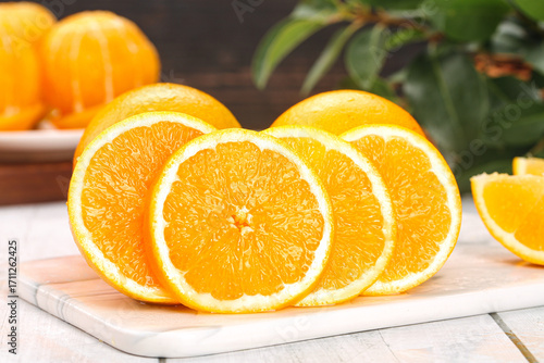 Fresh Newhall Navel Orange Slices on Cutting Board - Citrus Fruit Cross-Section Close-up
