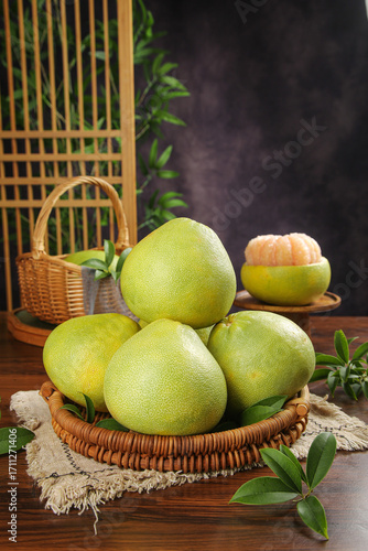 Freshly Picked Yuhuan Pomelos in Wicker Basket - Sweet Juicy Citrus Fruit Display on Rustic Wooden Table