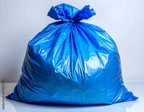 Full blue plastic trash bag